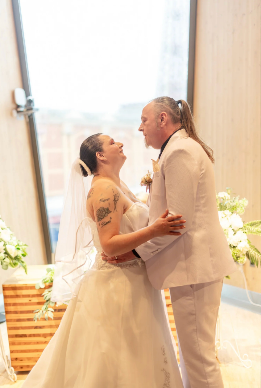 A newlywed couple sharing a quiet moment during their ceremony